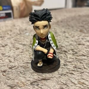 Anime Figure with Green and Black Outfit